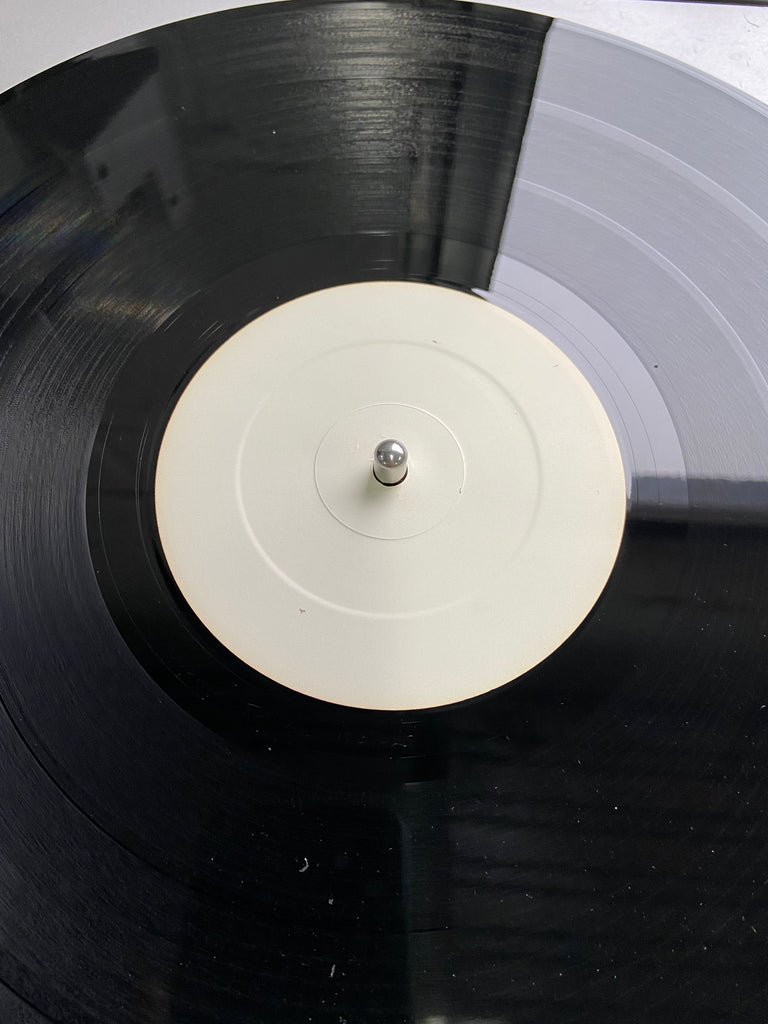 100 white label 12" records with white dust sleeves